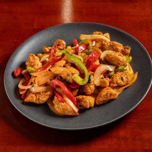 Pollo Salteado (Chicken with Peppers & Onions).
