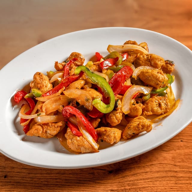 Pollo Salteado (Chicken with Peppers & Onions).